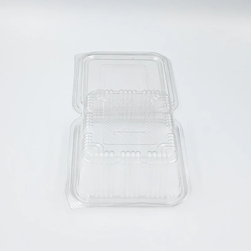 500ml 2 Clear plastic clamshell container lid photographed on a white surface.
