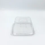 Clear plastic clamshell container photographed from above on a white background.