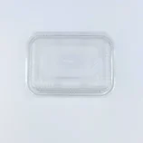 Clear transparent plastic clamshell packaging tray photographed from above, empty and open edge visible