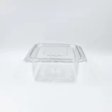 Clear plastic storage container with a snap-on lid on a white surface, viewed from above to show its top and edges.