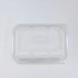 Transparent plastic takeout container with hinged lid, viewed from above